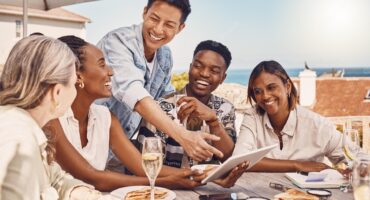 friends-employees-casual-workers-lunch-meeting-restaurant-planning-with-5g-tablet-talking-about-marketing-strategy-while-eating-food-cafe-happy-people-streaming-funny-videos_590464-81230